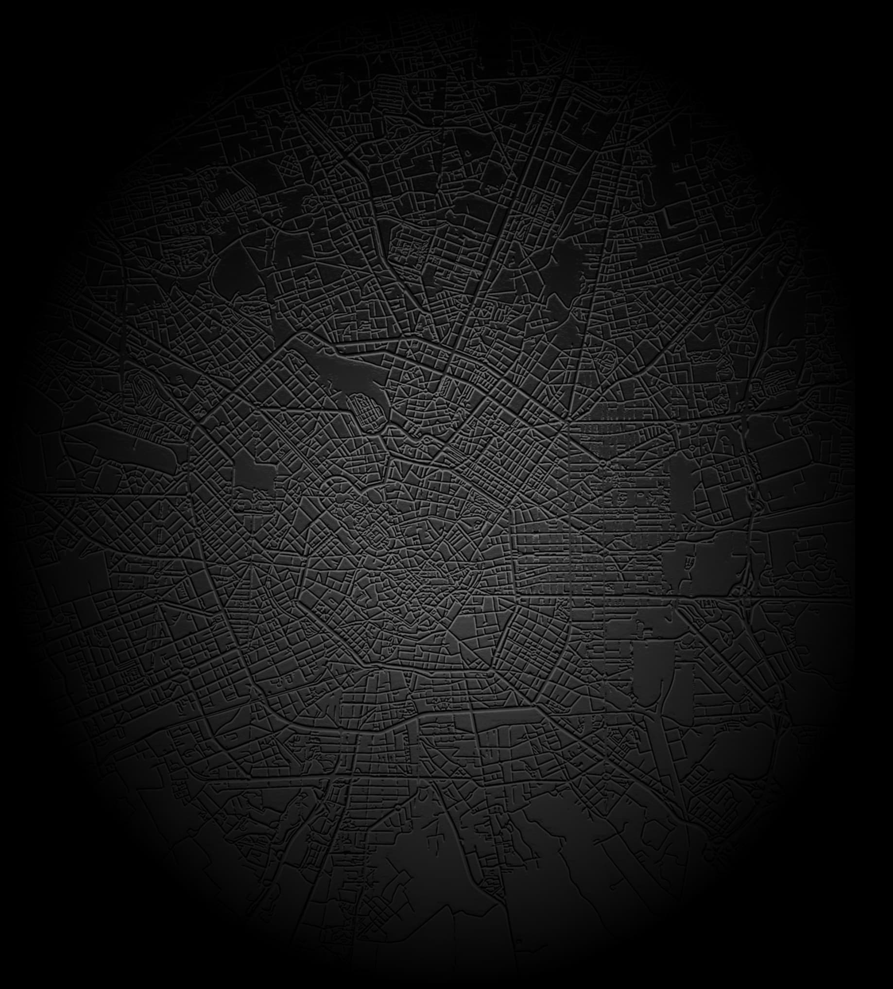Reference embossed circular city map with streets and urban blocks.